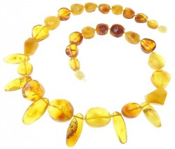 Beads made of figured amber stones